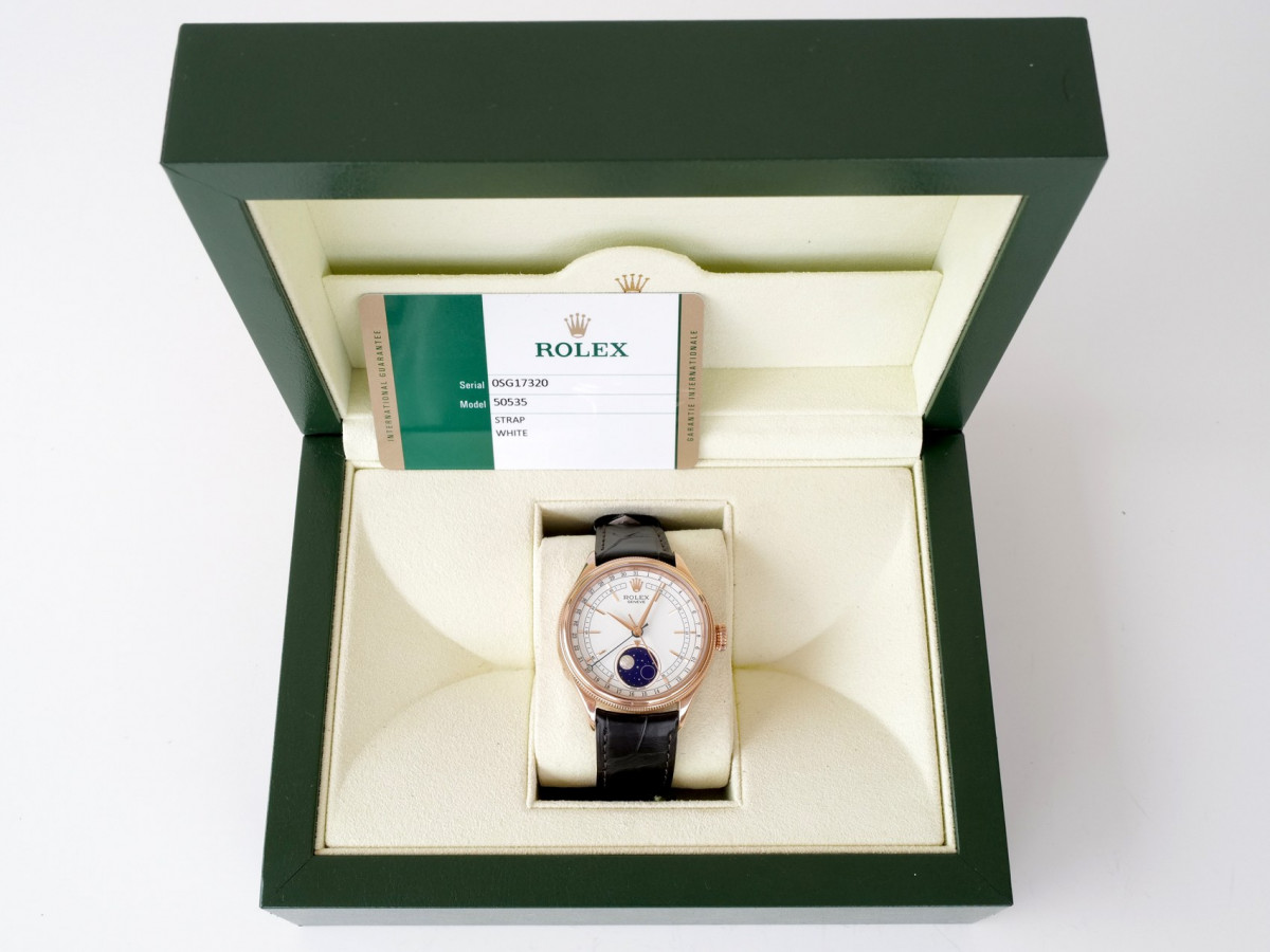Швейцарские часы Rolex Cellini Moonphase 18K Rose Gold White Dial Black Strap Discontinued