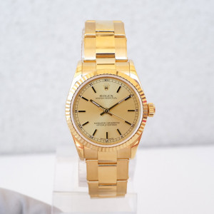 Швейцарские часы Rolex Oyster Perpetual 31 Champagne Dial 18K Yellow Gold