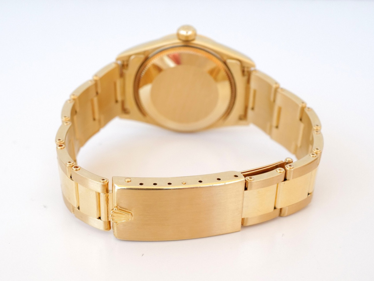 Швейцарские часы Rolex Oyster Perpetual 31 Champagne Dial 18K Yellow Gold